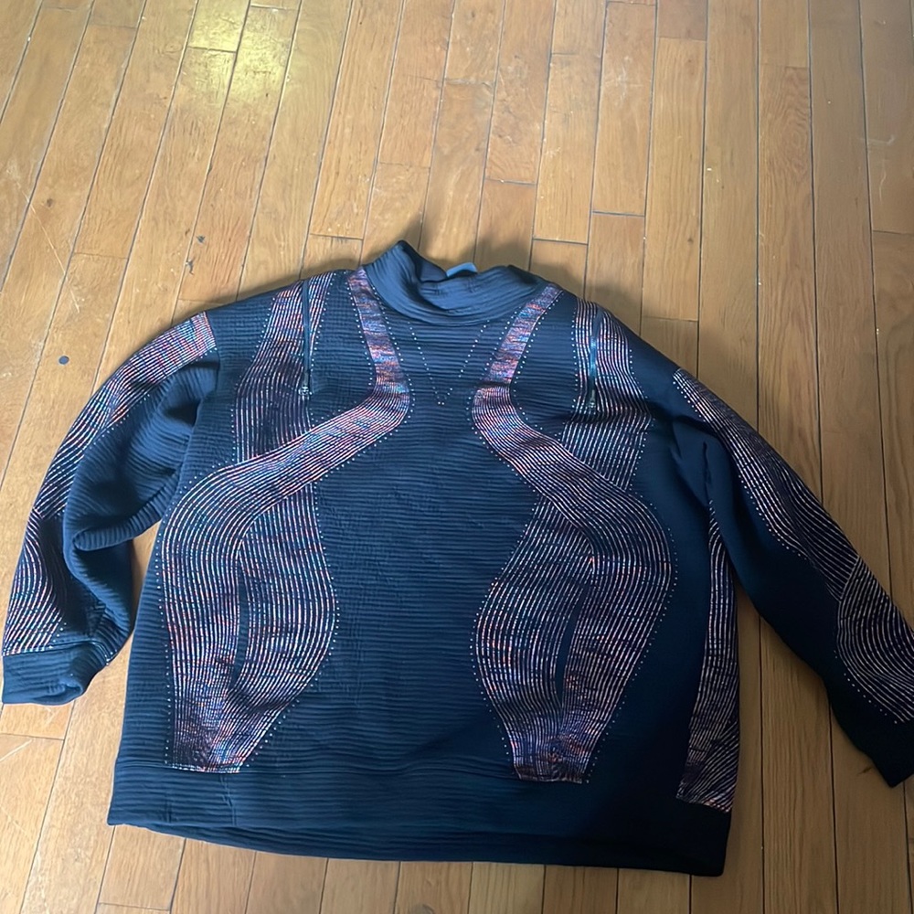 Extra large Nike sweater zips down from neck to neck